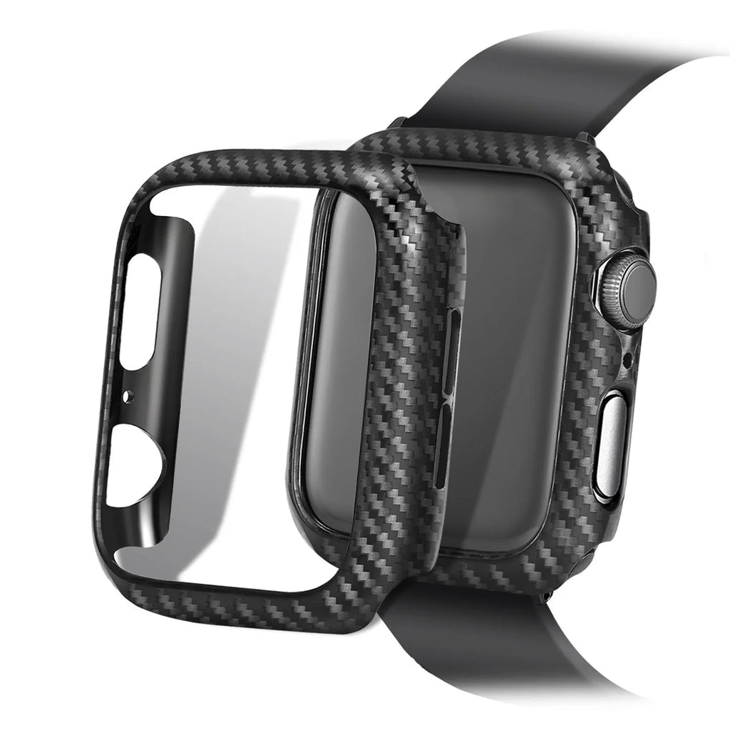 Leather and carbon fibre Apple Watch strap with red stitching next to a black PC case with carbon fibre pattern.