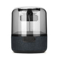 Black portable Bluetooth speaker with multi-colour LED light ring and control buttons on top.