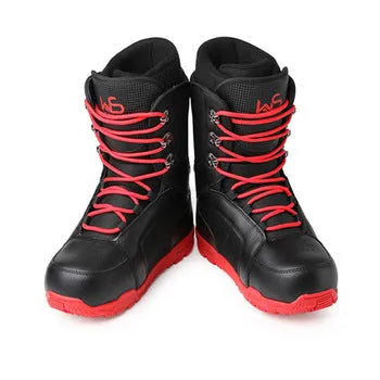 Black men's ski boots with tie closure and rubber outsole on a snowy surface