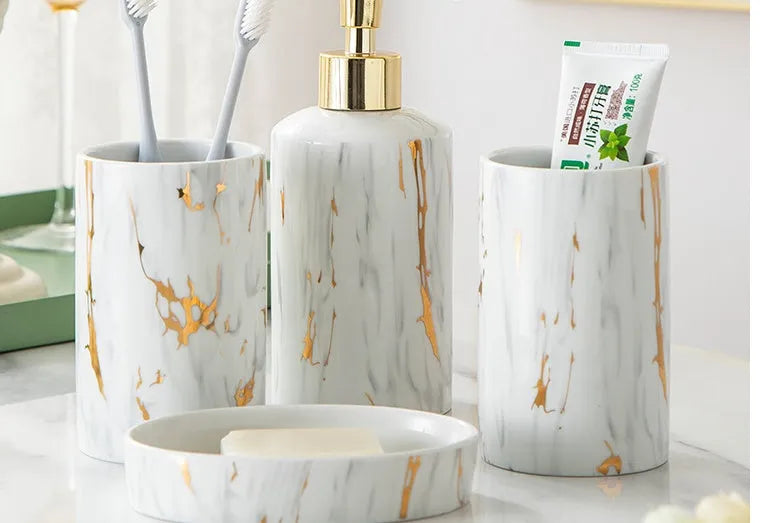 White ceramic bathroom wash kit with cup, soap box, and latex bottle