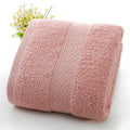 Thick bath and beach towels in seven colour options including apple green, dark blue, and light pink