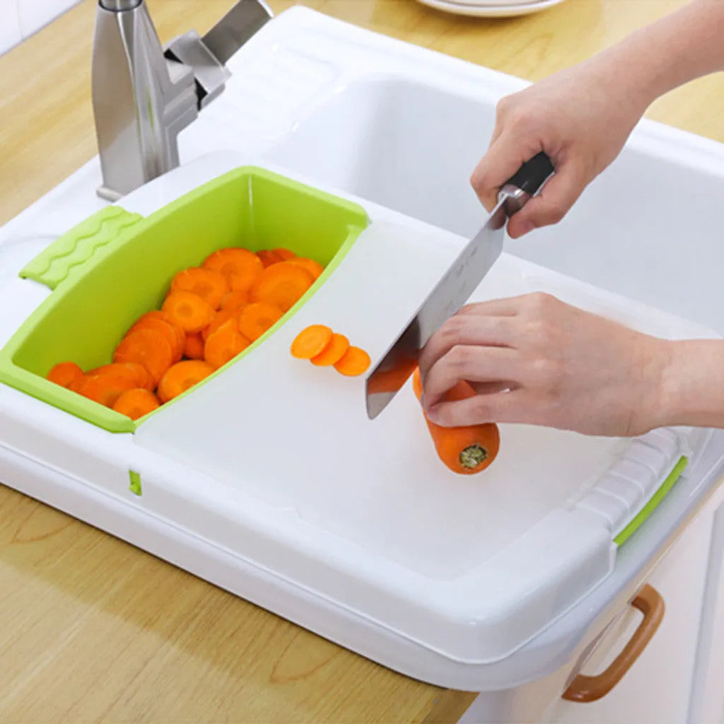 Green multi-function cutting board with drainage holes mounted on a kitchen sink