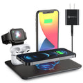 Black and white desktop wireless charging station holding a phone, watch, and headphones with a USB cable.