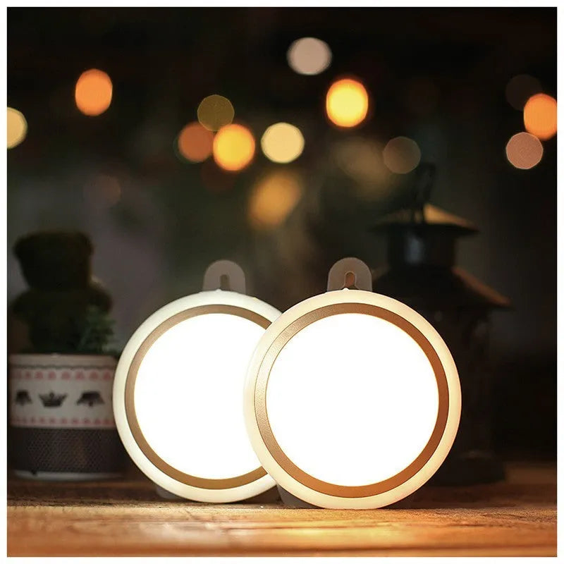 Compact round white motion sensor LED light unit for cupboards and hallways.