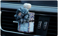 Car flower outlet perfume air freshener in white colour clipped to vehicle air vent, 3.2cm x 7cm size