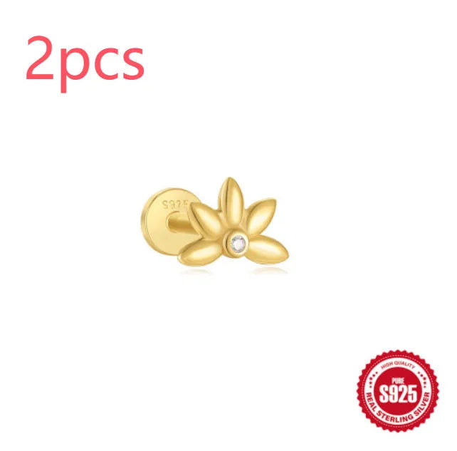 S925 sterling silver ear stud with XINGX inlaid tassel design in a gold colour.