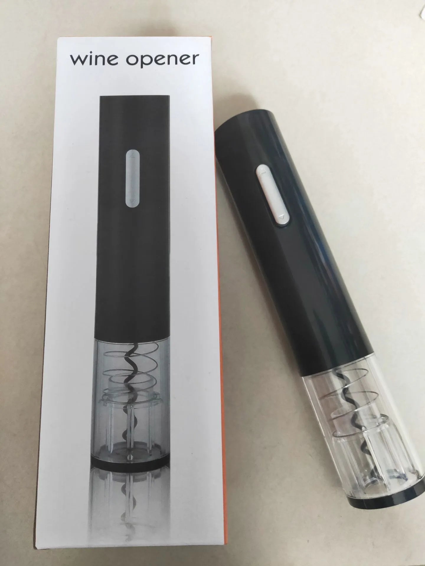 Automatic electric wine bottle opener with foil cutter in black, red, or white plastic finish.
