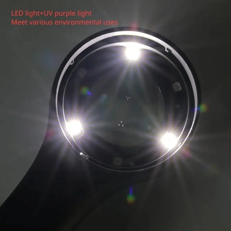 Illuminated black magnifying glass with optical glass lens for jewellery and stamp appraisal on a table.