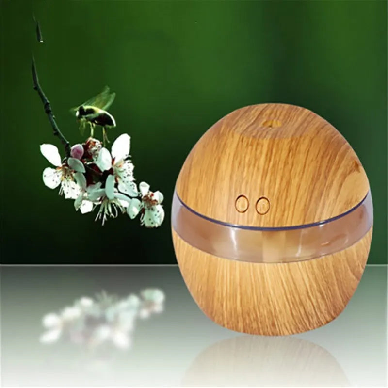Compact brown wood grain USB humidifier with 200ml water tank on a desk.
