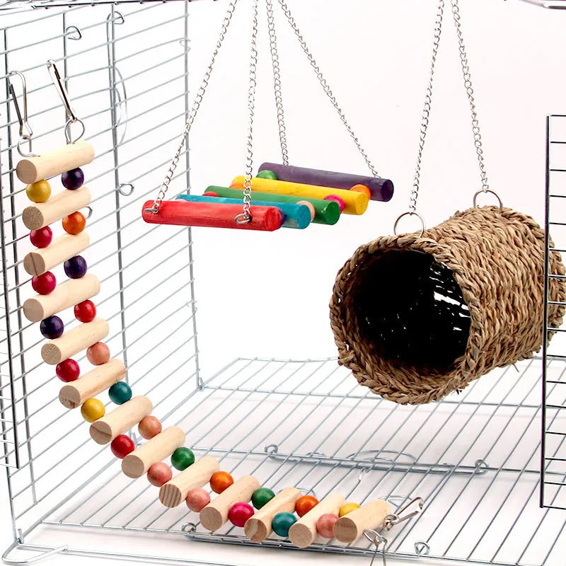 Natural wood small pet toy set with swing, climbing ladder and cotton grass bed on white background