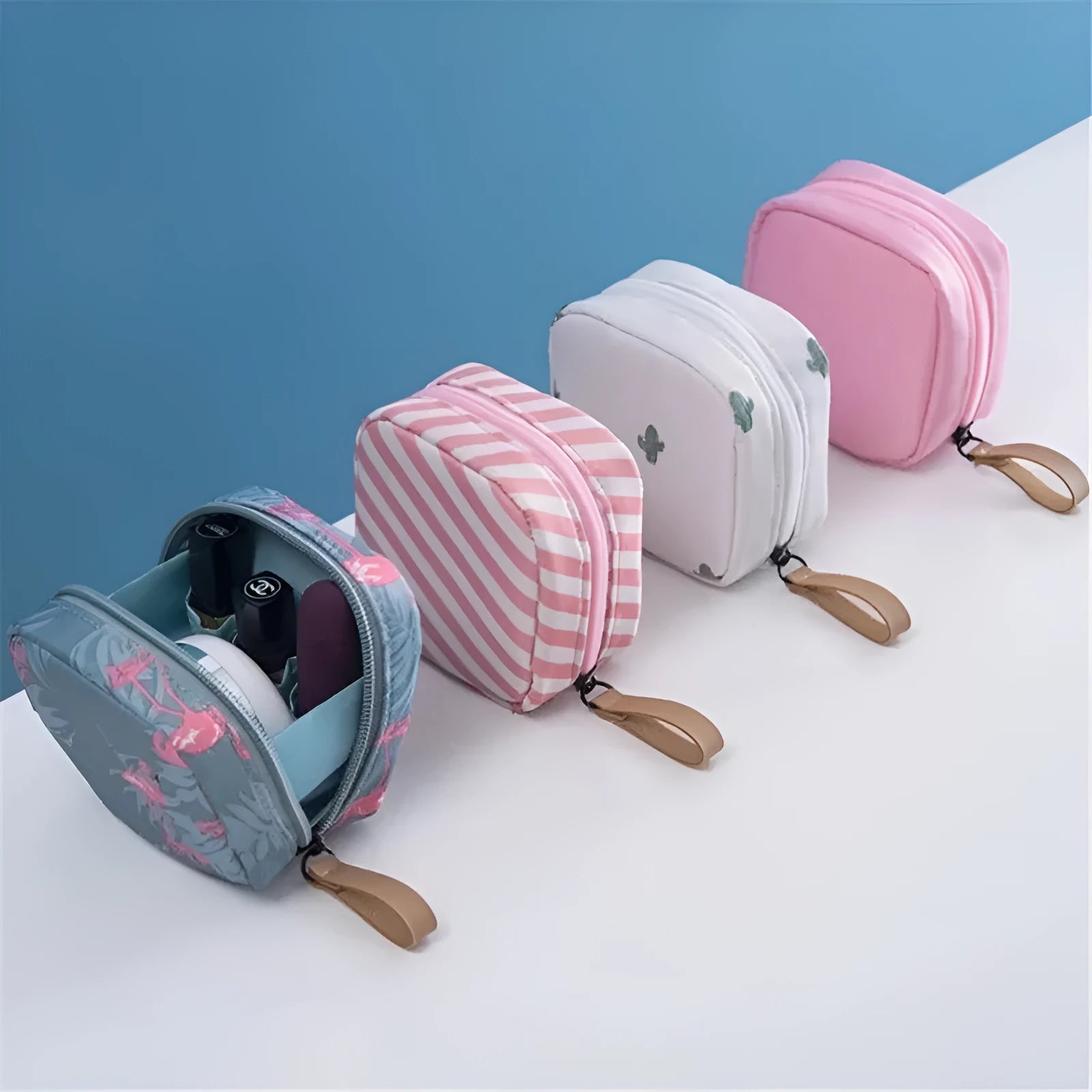 Blue cloth cube-shaped makeup storage bag with a plain pattern on a flat surface.