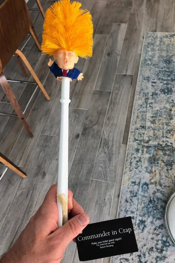 Yellow plastic Donald Trump novelty toilet brush with hanging slot, 40cm length