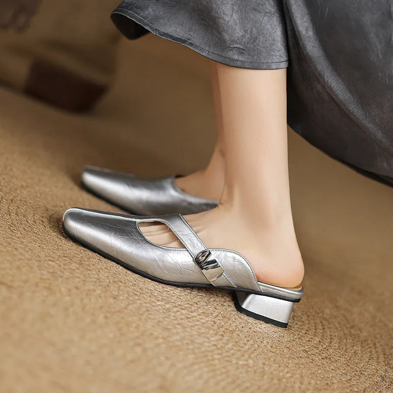 British style square toe outdoor slippers in beige with a low heel and rubber sole.