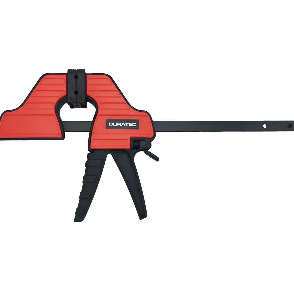 Black plastic woodworking clamp with quick-release trigger and soft rubber protective jaws.