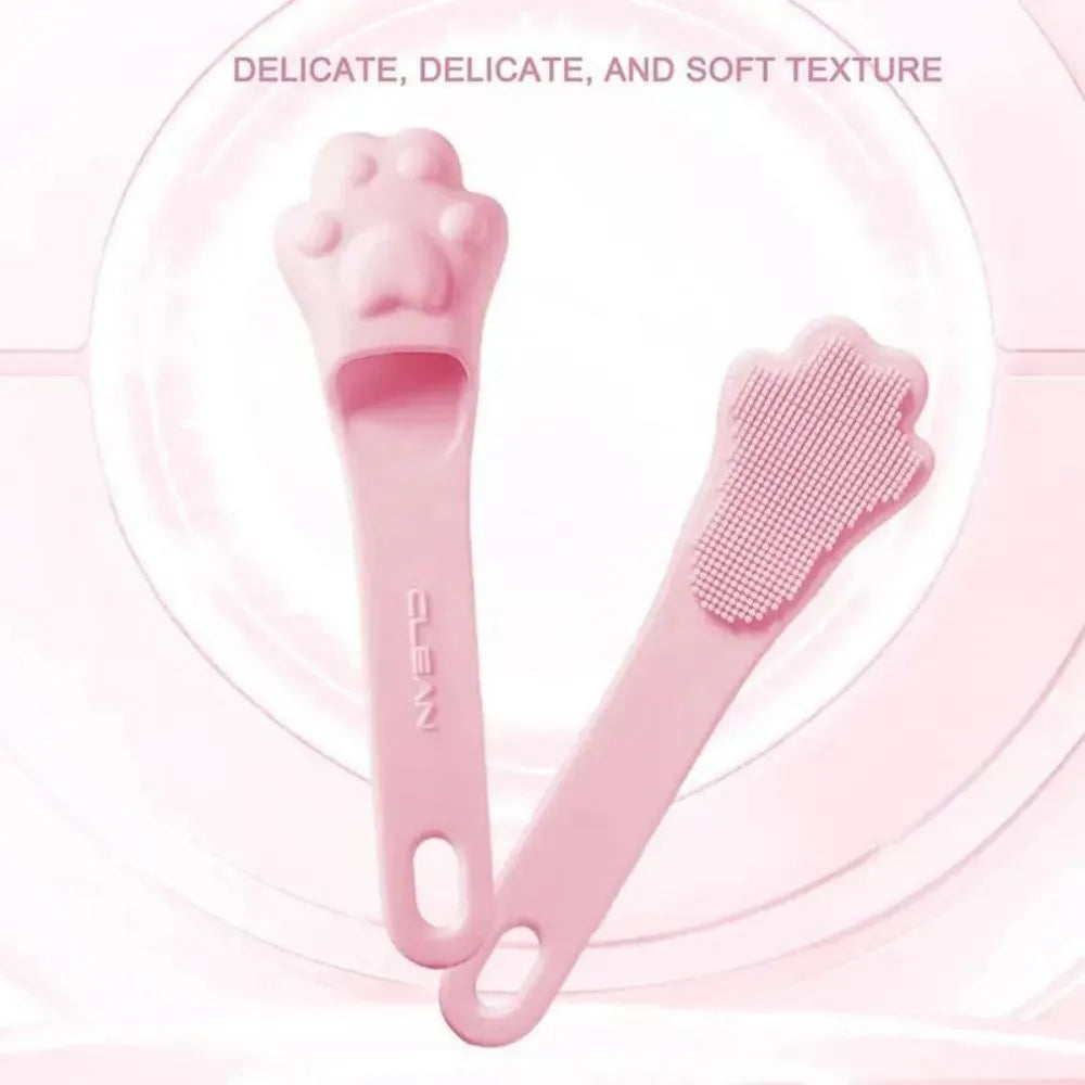 Silicone finger toothbrush for pets in pink, purple, and yellow colours
