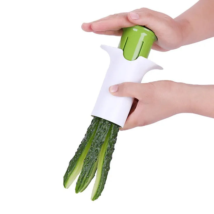 White vegetable cutter tool with six stainless steel blades for slicing cucumbers and carrots