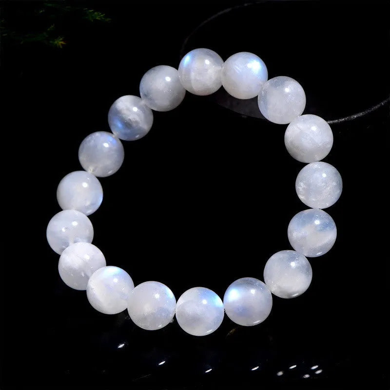 Natural blue moonlight round bead moonstone bracelet on a white background.