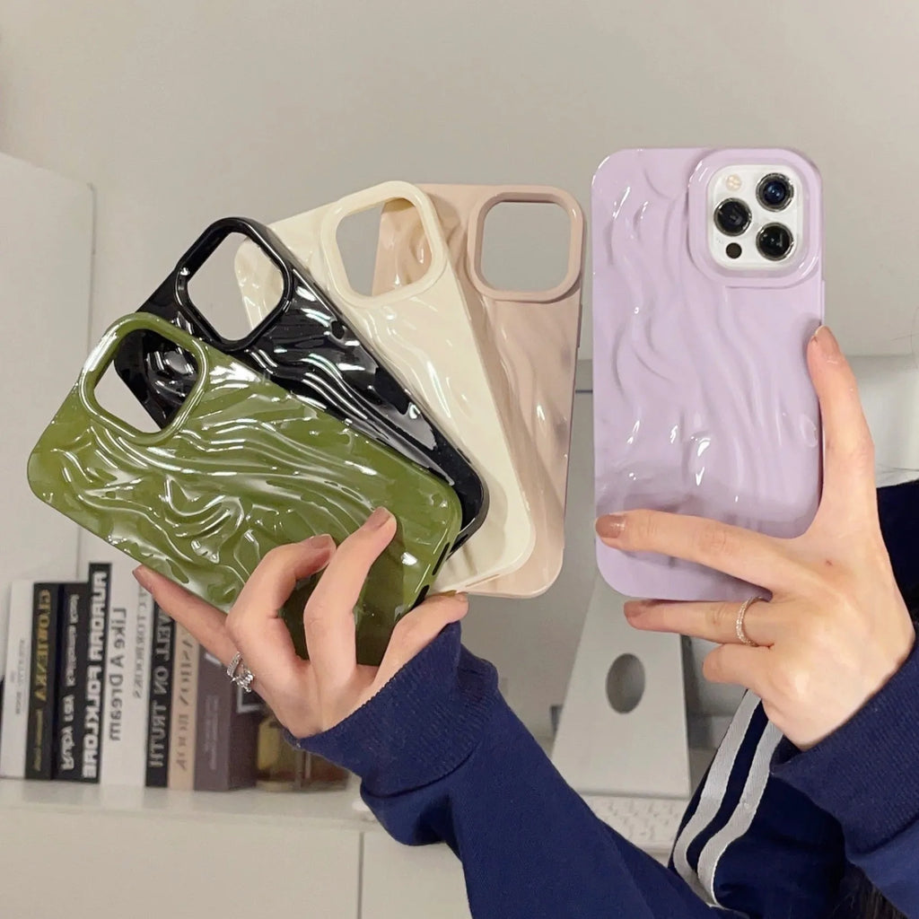 Solid colour water ripple texture silicone case for iPhone on a table.