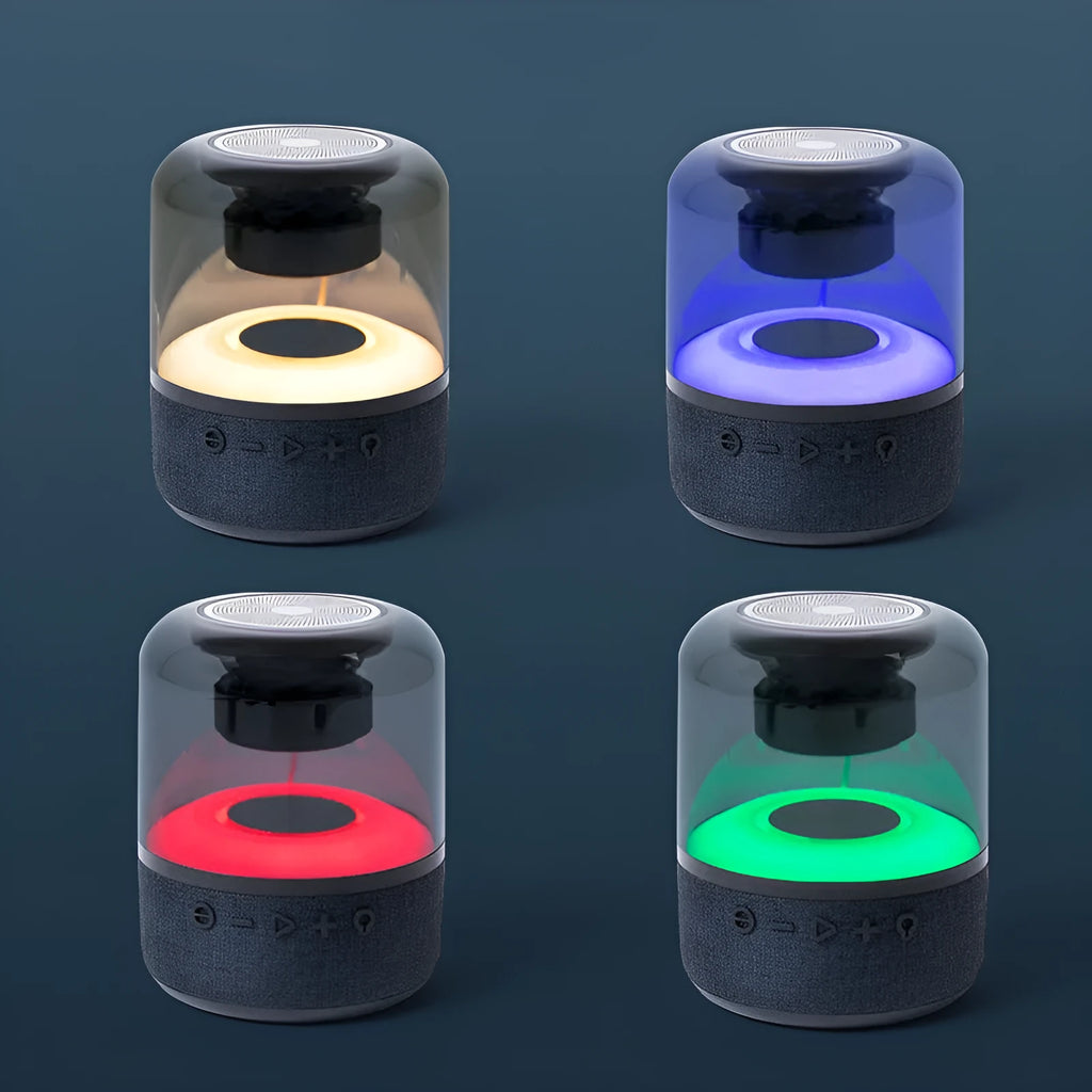 Black portable Bluetooth speaker with multi-colour LED light ring and control buttons on top.