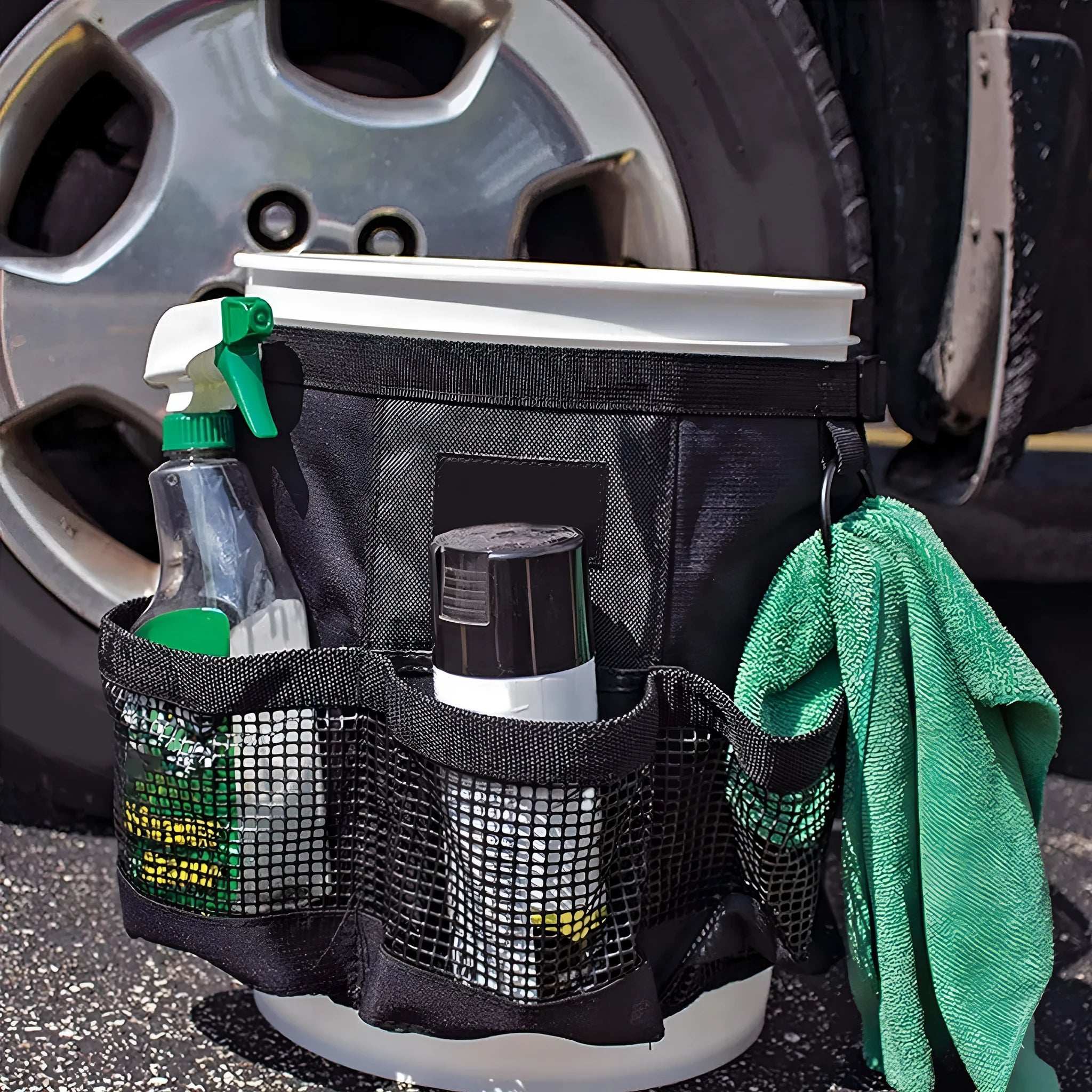 Black cylindrical polyester hanging storage bag fitted on a 5-gallon barrel.