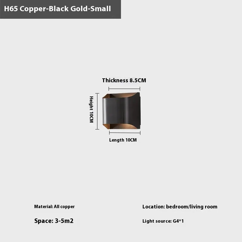 Minimalist copper wall lamp with black gold finish mounted beside bed