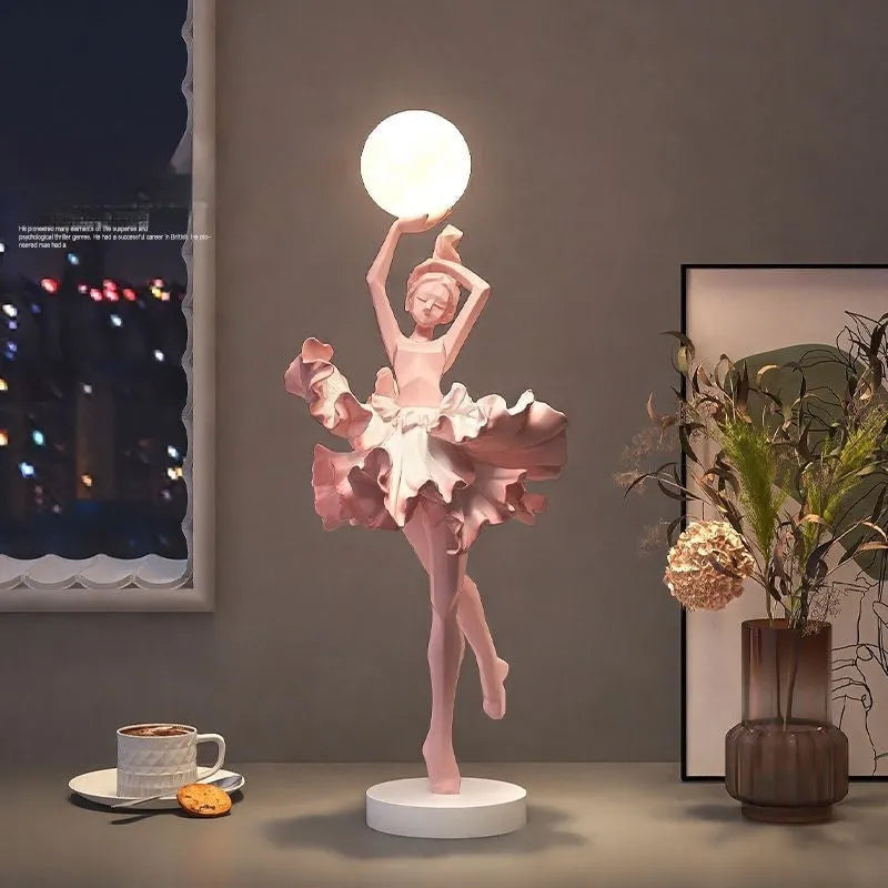 Modern art girl style resin night light with USB charging cable in black gold colour.
