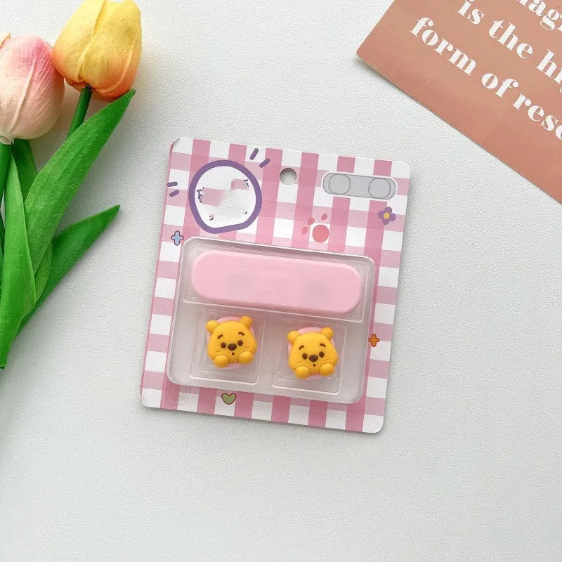Plastic cartoon-style magnetic data cable fixer clip on a desktop