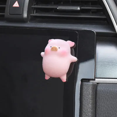 A hard resin cartoon pig car dashboard ornament in one of eight available decorative styles.