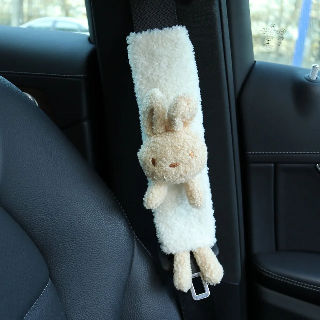 Cartoon plush lamb wool car seatbelt shoulder protector in bear and rabbit designs.