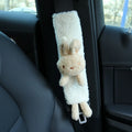 Cartoon plush lamb wool car seatbelt shoulder protector in bear and rabbit designs.