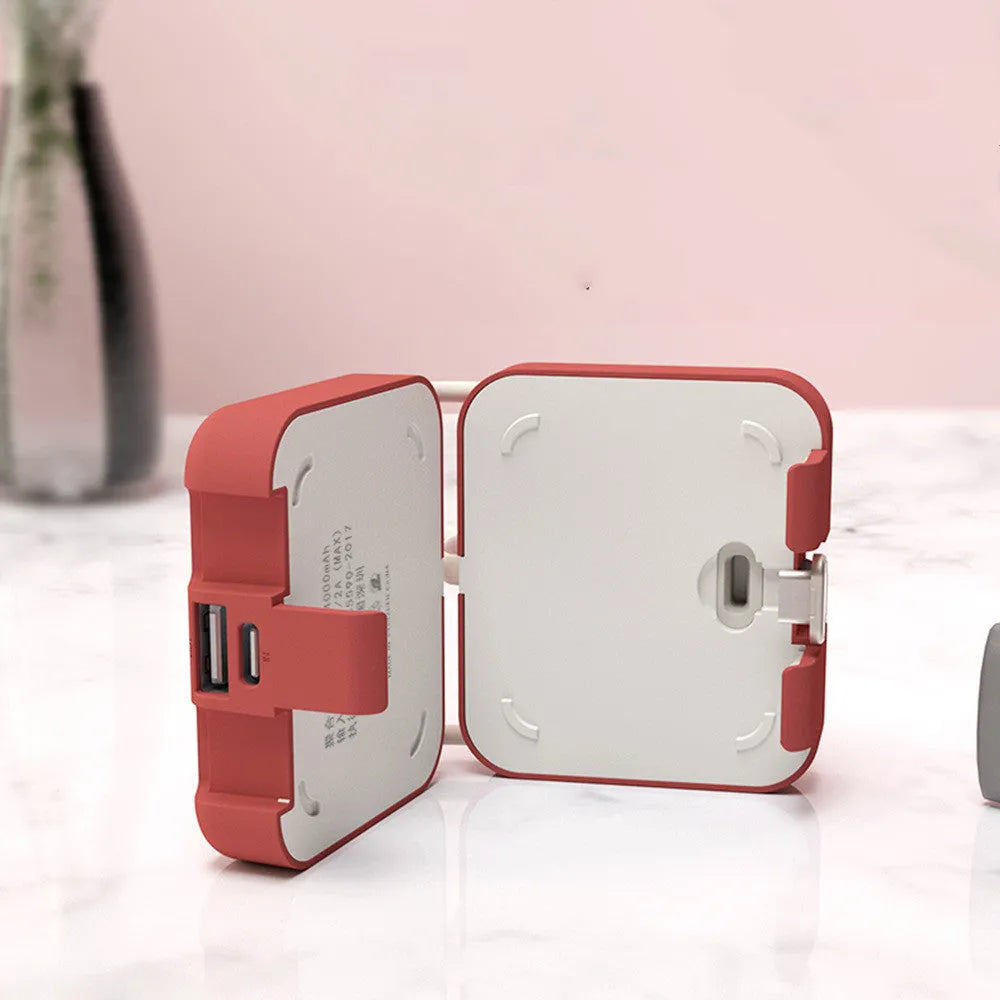 Handbag clip-on power bank in blue showing USB-A, Type-C and Lightning ports and built-in phone stand