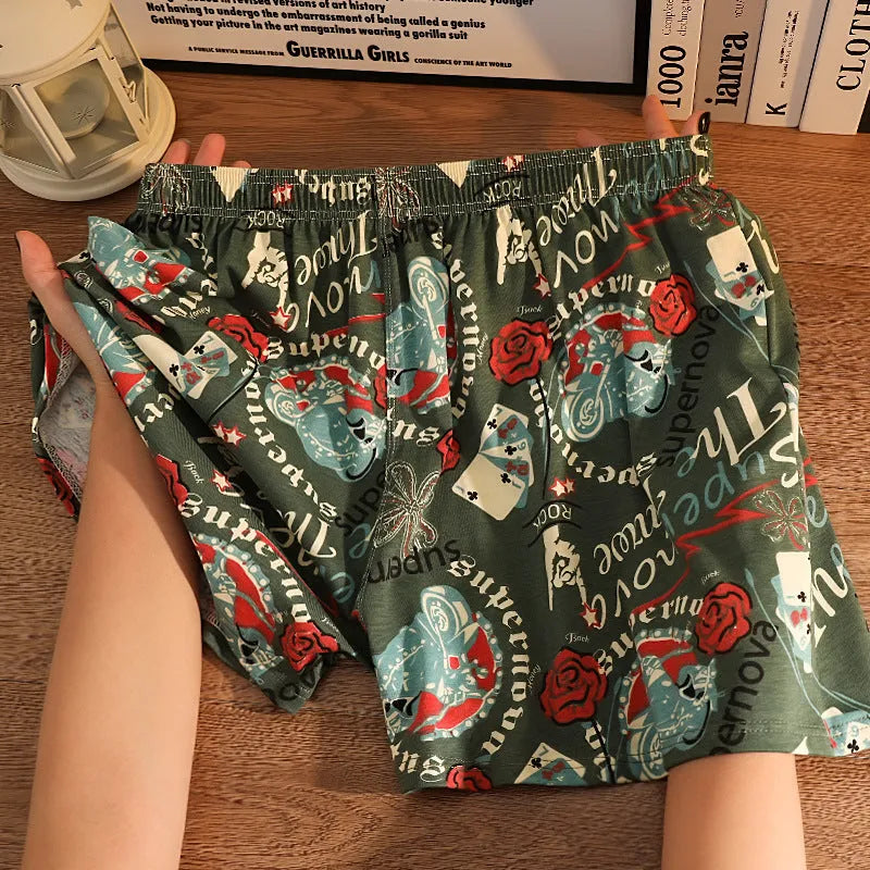 Men's grey printed cotton boxer shorts with a loose, casual fit and mid-waist design.