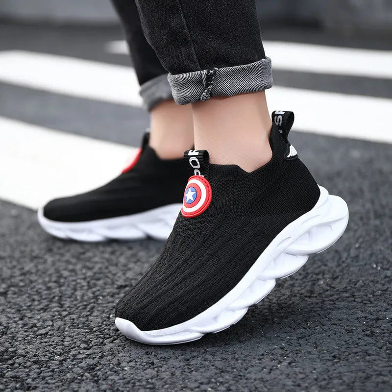 Black and white knitted sleeve-style overshoes with MD sole for runway wear