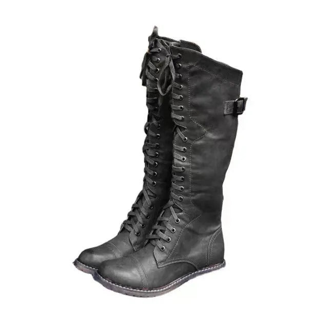 Women's black chunky heel high leg boots with a round toe and pull-on design.