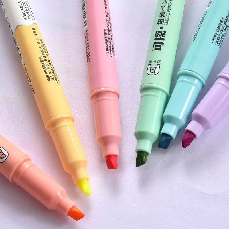 Set of six double-headed fluorescent graffiti marker pens with plastic shells and assorted colours