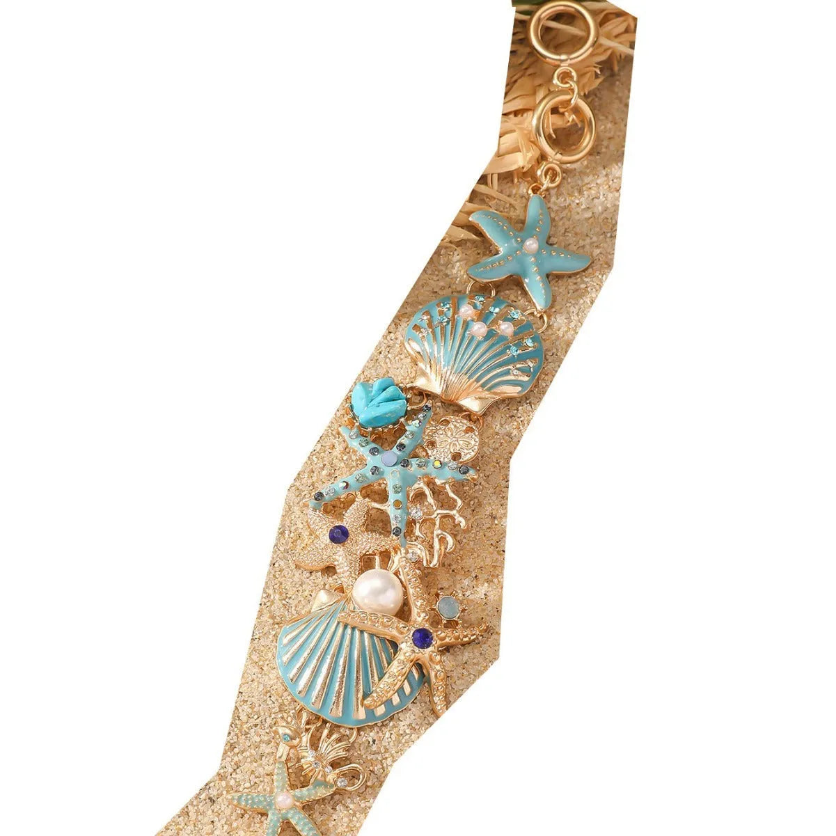 Alloy rhinestone bracelet with boat anchor, shell, and starfish charms in turquoise, red, or blue.