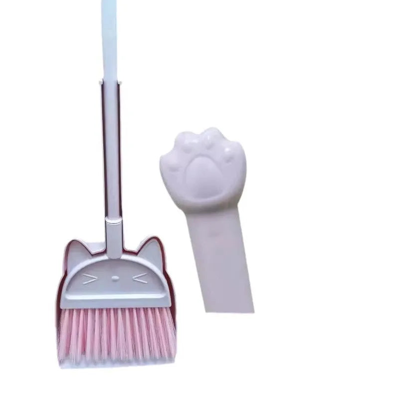 Purple, green, and beige plastic broom and dustpan set with a rotating brush head.
