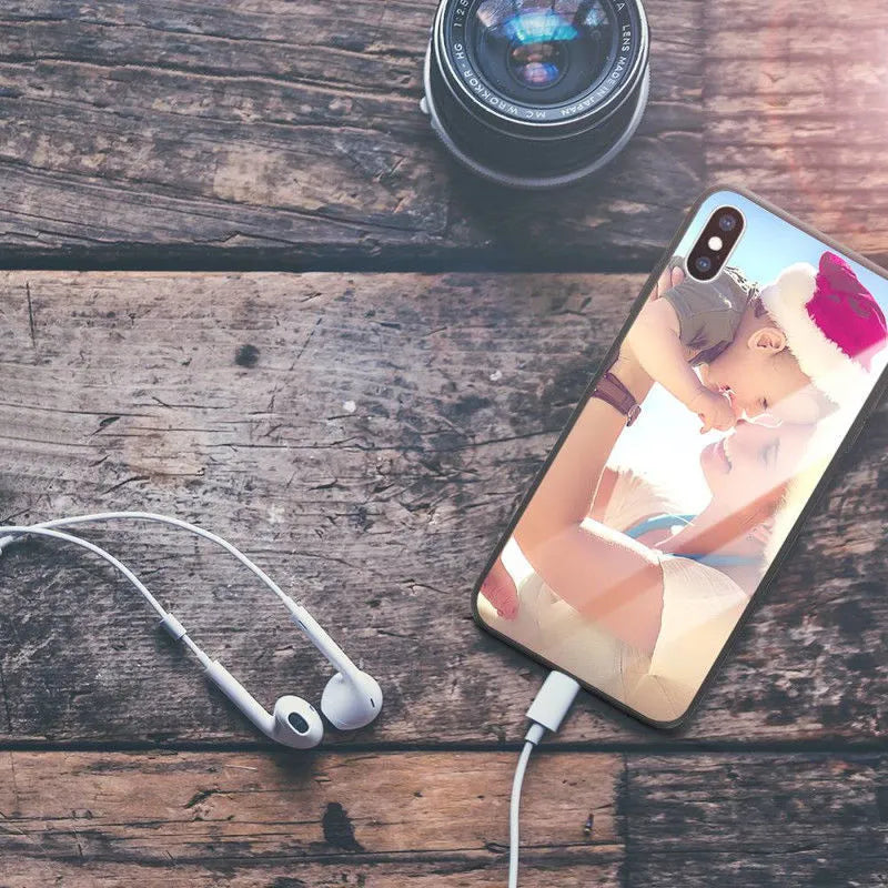 Slim patterned protective case for Apple iPhone with raised edges around screen and camera.