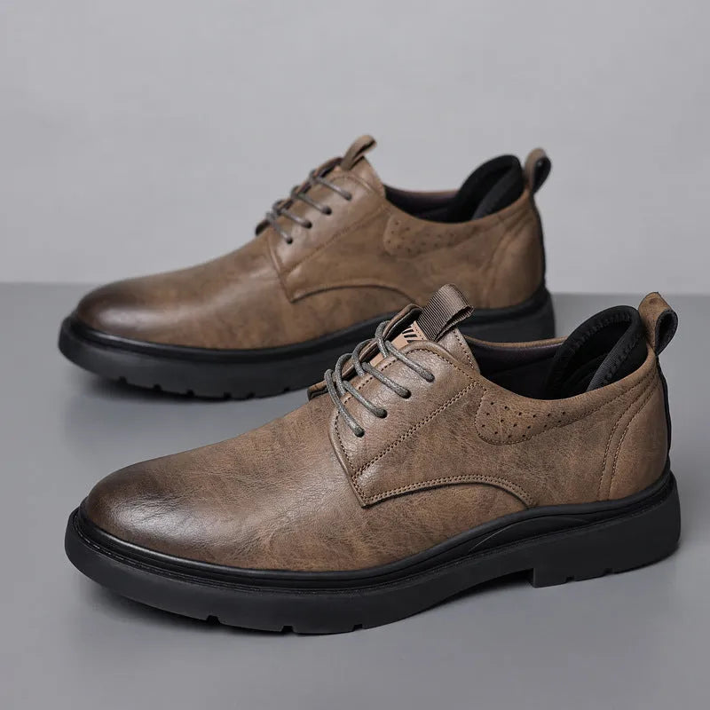 Men's black leather casual sneakers with sewing line detail on a two-layer cowhide upper and rubber sole.