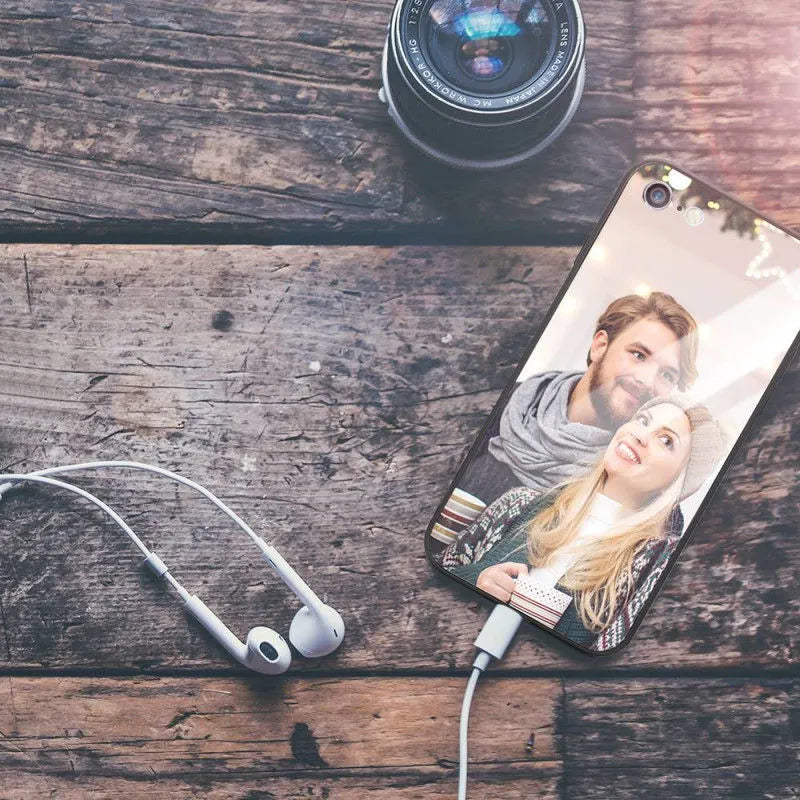 Slim patterned protective case for Apple iPhone with raised edges around screen and camera.