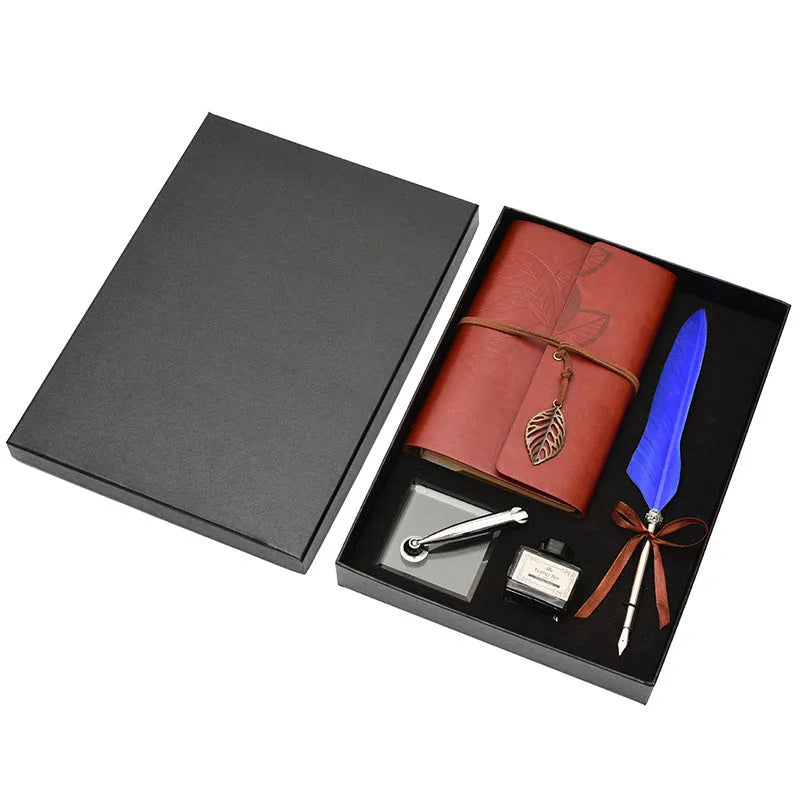 Feather dip pen gift set with copper pen, ink bottle, acrylic base, and antique book in box