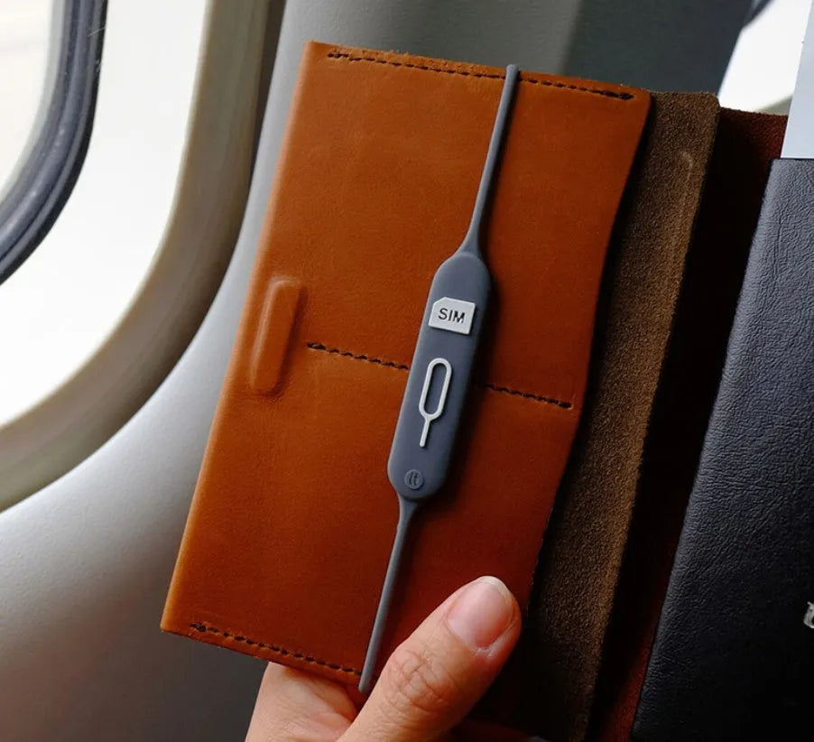 Silicone card slot holder with open-top design in green grey colour showing internal card positions