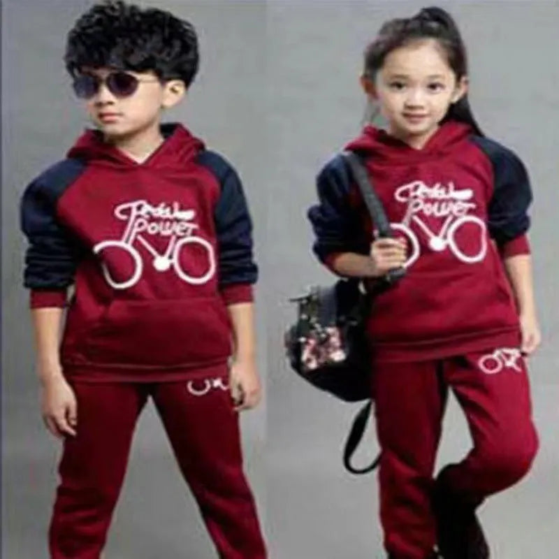 Older child wearing a black Korean-style long sleeve sweater sports suit set.