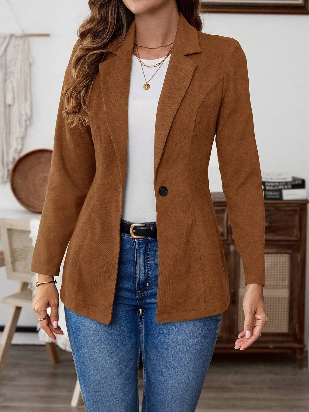Brown single-breasted lapel blazer for men on a hanger.