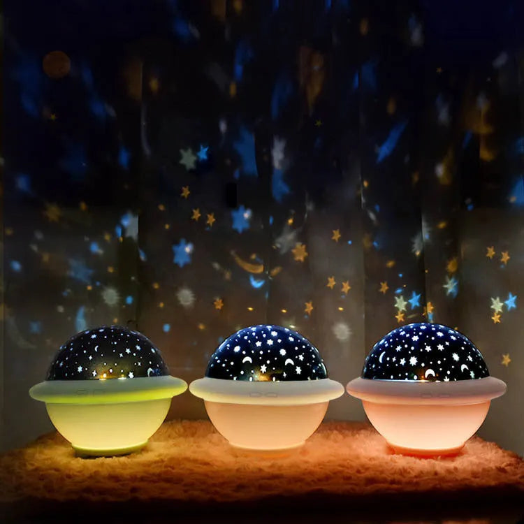 UFO-shaped plastic starry sky projection night light in green, pink or white colour.