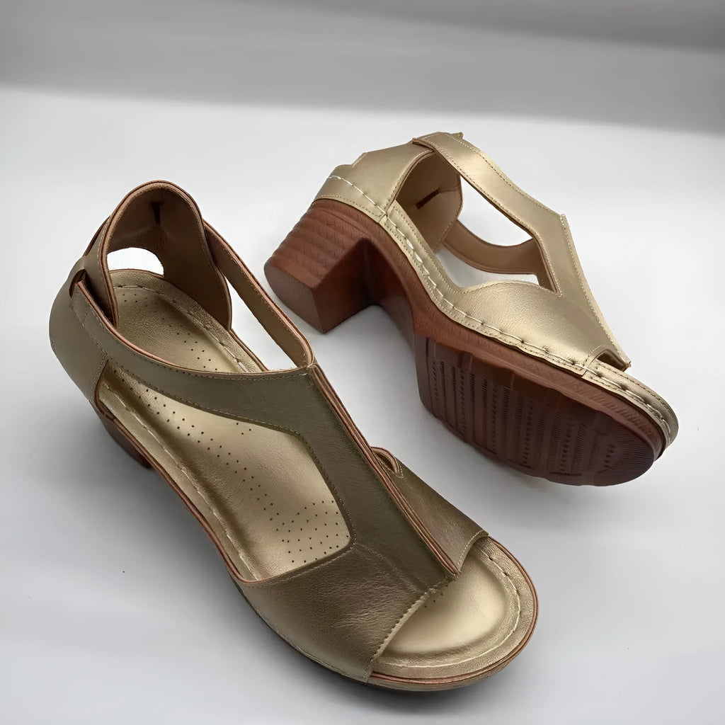 Women's low heel peep toe wedge sandals with a Roman style buckle strap in light brown.