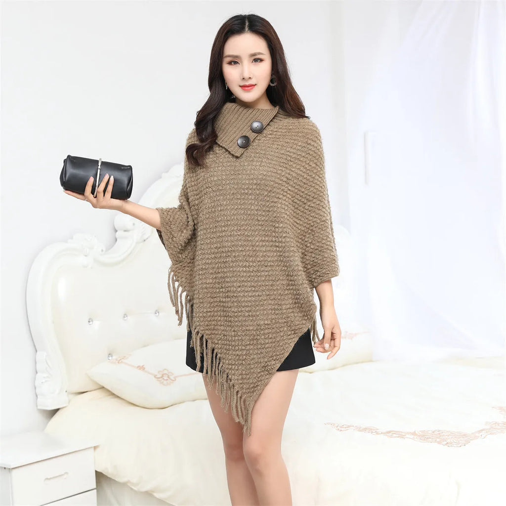 Women's dotted pattern sleeveless knit cloak shawl in acrylic fibre, shown in apricot colour.