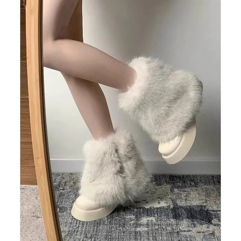 Women's black artificial plush snow boots with a waterproof rubber sole and fleece lining.
