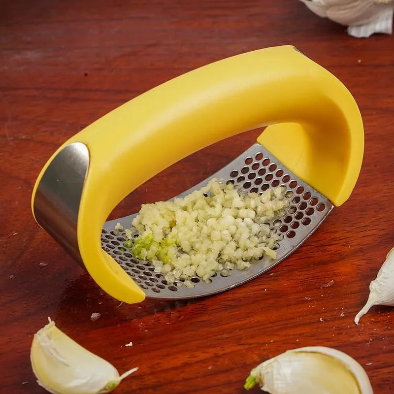 Stainless steel manual garlic press with ergonomic handle in assorted colours