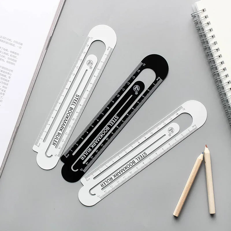 Black and white two-sided ruler showing 12cm length with manganese steel construction